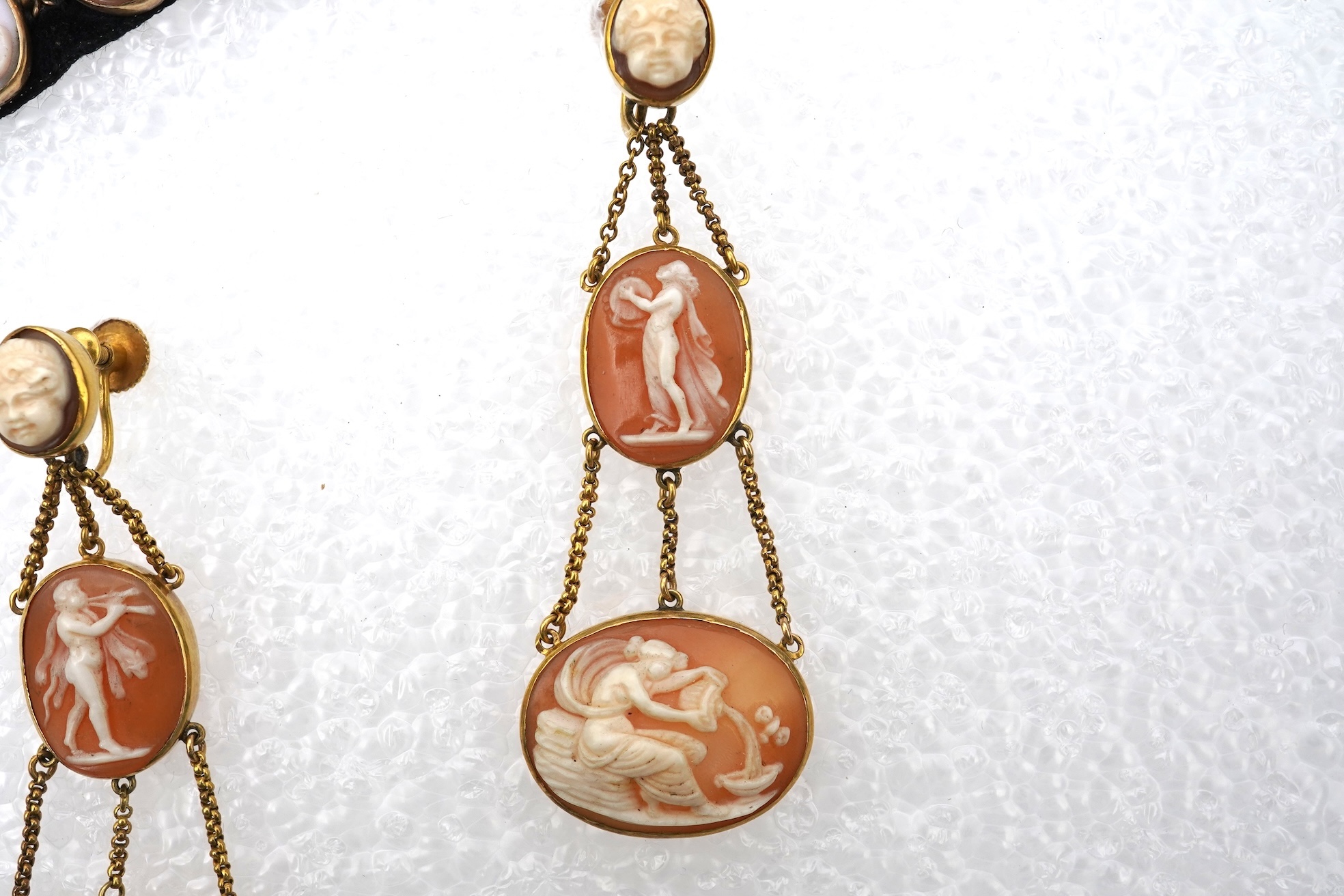 A pair of shell cameo earrings and bracelet, 19th century